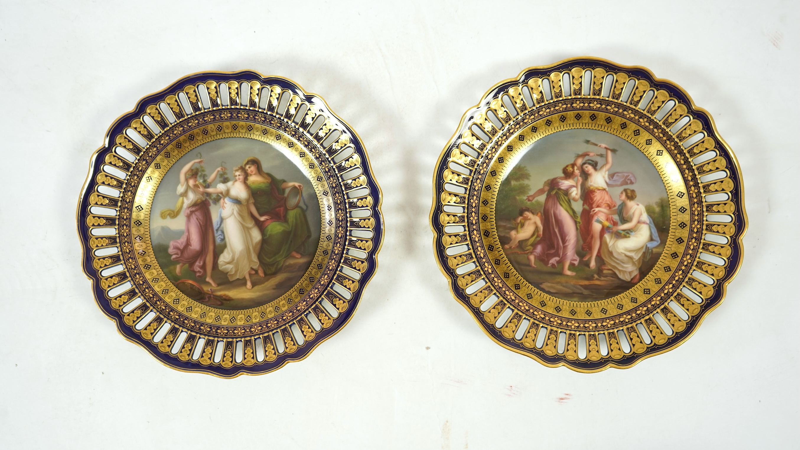 A pair of 19th century Meissen 'Three Graces' cabinet plates, after Angelica Kaufmann, 24cm in diameter. Condition - good